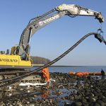 Large Crane Holding Cable for Underwater Installation Near Long Island, NY