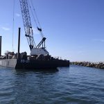 Marine Construction Equipment Working on Brake Wall