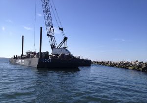 Marine Construction Equipment Working on Brake Wall