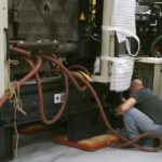 BAC technician at work on Energizer Schick machinery