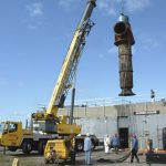 crane hauling old saltwater pump in New Haven, CT